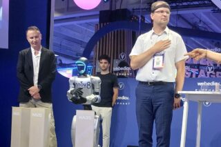 Image At VivaTech, a Human Communicated with a Humanoid Robot Through Thought