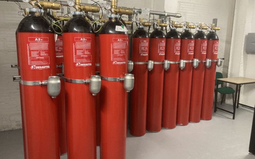 The automatic fire suppression room: rows of A2+ gas cylinders (Desautel technology) providing fire protection for the site, including in the event of a lithium battery failure.