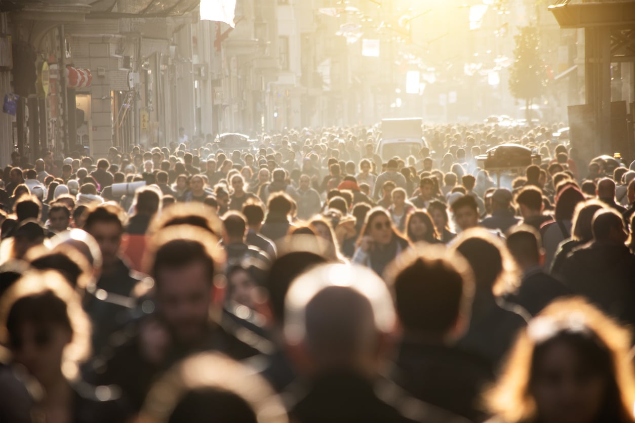 Blurred crowd of unrecognizable at the street / iStock